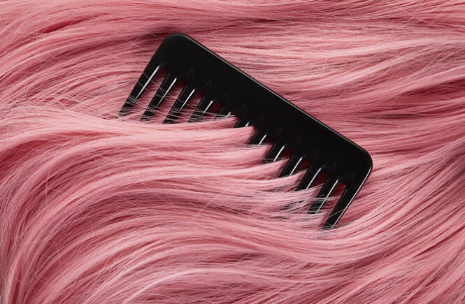 Top view of comb on colored pink hair